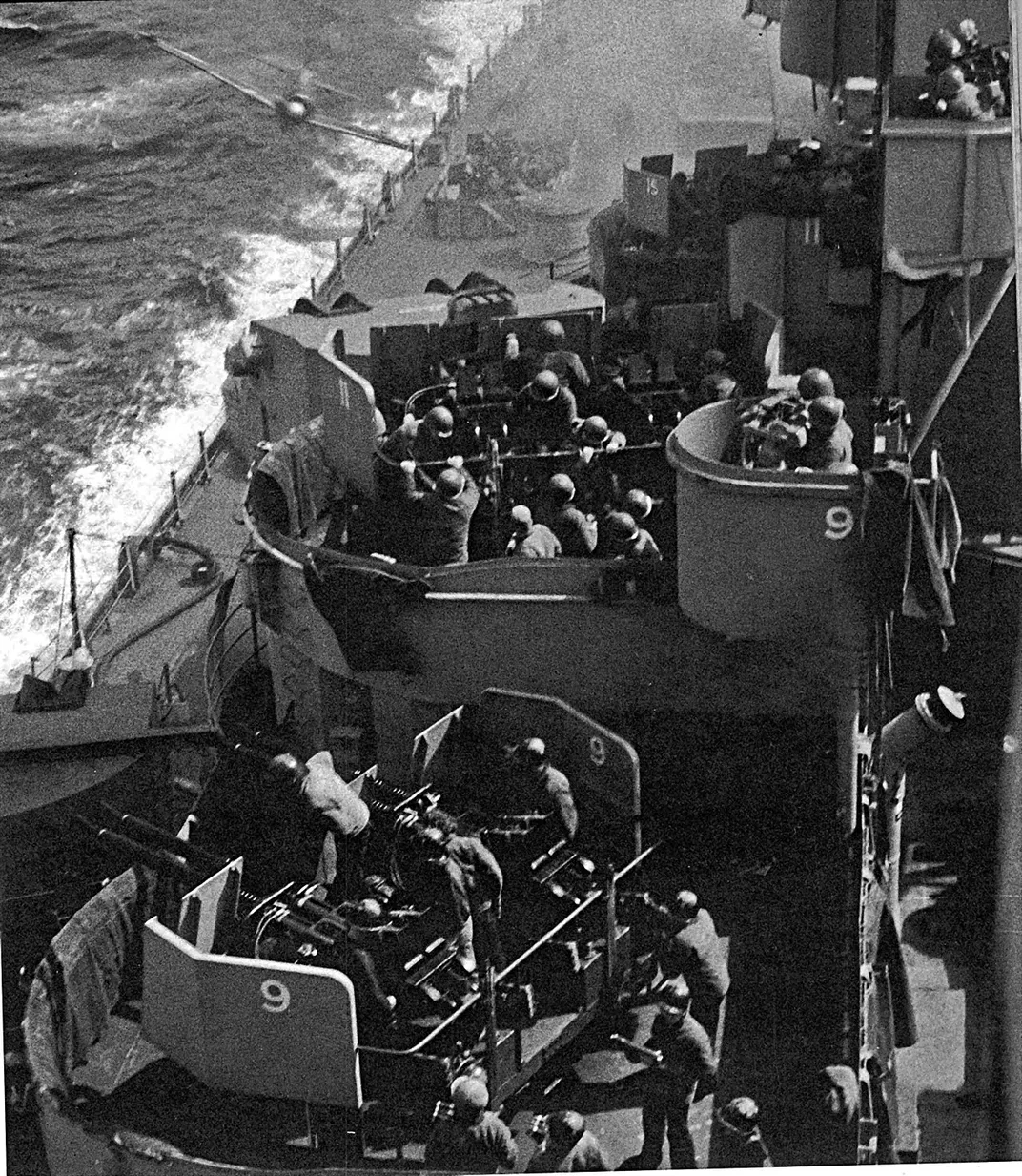 A kamikaze pilot (top left) moments before striking the Missouri's side on April 11, 1945