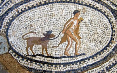 A mosaic of Hercules with pet Cerberus.