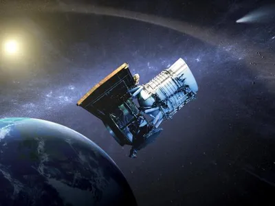 An artist&#39;s illustration of the WISE spacecraft in orbit around Earth. The mission was renamed NEOWISE in 2013 to reflect a new focus on finding near-Earth objects.