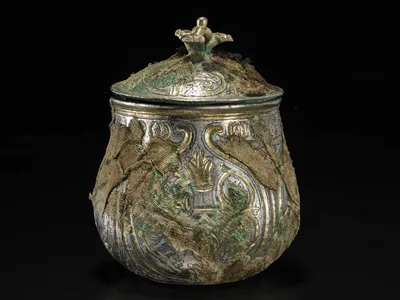 This silver lidded vessel was discovered in Scotland as part of the Galloway Hoard, but originates from Asia.